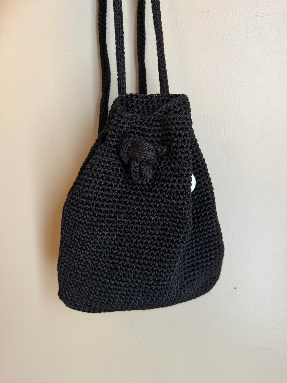 The Sak Black Crochet Drawstring Backpack Purse Woven Bucket Sling Bag Small
